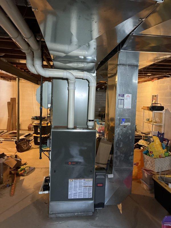 Provided full system replacement estimate for large residential property experiencing no cooling condition and multiple furnace malfunctions. Assessed existing basement-installed gas furnace and air conditioning unit, noting AC outdoor unit positioned near tree with debris accumulation affecting performance. Presented three-tier replacement options ranging from 13.4 to 16 SEER cooling systems paired with 80% to 96% AFUE gas furnaces to address complete system failure.