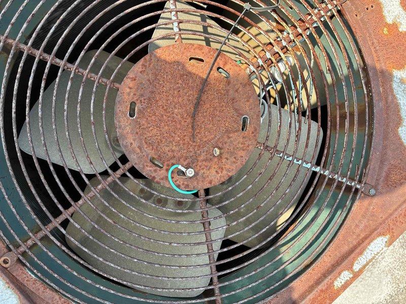 Responded to service call for non-operational air conditioning unit. Upon inspection, found rooftop commercial HVAC condenser with significant rust corrosion on mounting platform and electrical component housings, along with heavily weathered fan assembly showing oxidation on protective grille and central hub. Assessed electrical disconnects including Mars, DiversiTech, and Siemens components for proper operation and connections, verified condenser fan motor functionality, and restored unit to operational status.