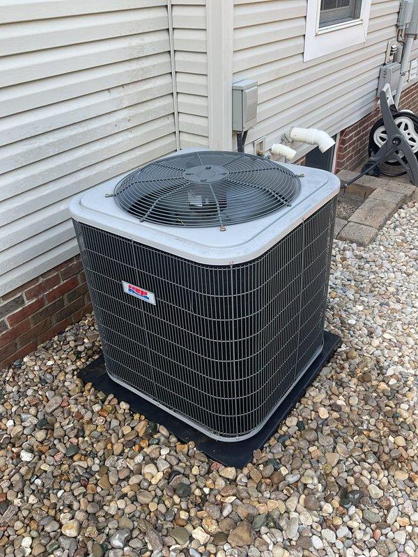 Completed comprehensive cooling season tune-up on residential outdoor condenser unit. Performed standard maintenance inspection of all accessible components including condenser coils, fan assembly, and electrical connections. Unit operating within normal parameters with coils showing adequate cleanliness and proper airflow through heat exchange fins.