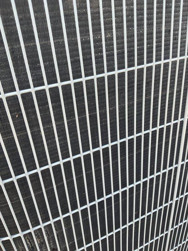 Completed comprehensive cooling season tune-up on residential outdoor condenser unit. Performed standard maintenance inspection of all accessible components including condenser coils, fan assembly, and electrical connections. Unit operating within normal parameters with coils showing adequate cleanliness and proper airflow through heat exchange fins.