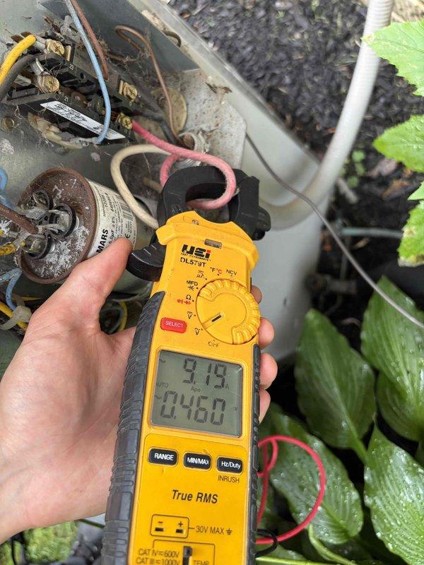 Completed comprehensive cooling system tune-up and performance evaluation. Verified system operation with temperature differential measurements showing 57.2°F at evaporator coil with proper frost formation, and conducted electrical diagnostics using clamp meter revealing 9.13A draw with 0.460 readings, confirming optimal compressor and capacitor performance within manufacturer specifications.