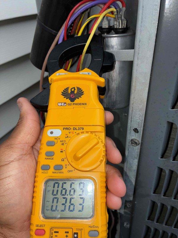 Performed comprehensive cooling season tune-up on residential HVAC system. Inspected and verified blower wheel assembly condition, confirmed proper operation and cleanliness of squirrel cage blower with no significant debris accumulation. Conducted electrical diagnostics on outdoor condensing unit using clamp meter, measured and recorded amperage readings to verify compressor and system performance within manufacturer specifications.