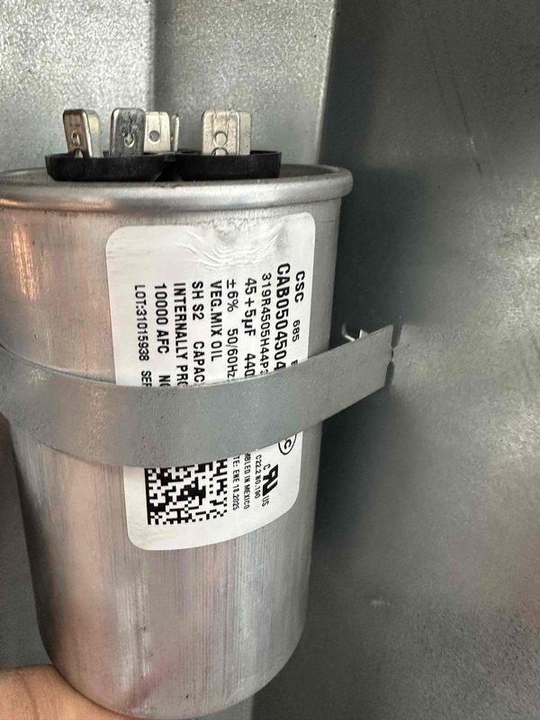 Completed comprehensive first-year preventive maintenance on residential cooling system. Inspected and tested dual-run capacitor (45+5 MFD, 370VAC) for proper operation and verified all electrical connections were secure. Examined blower motor wiring harness, condenser unit components, and ductwork; found all systems operating within normal parameters with no immediate repairs required.