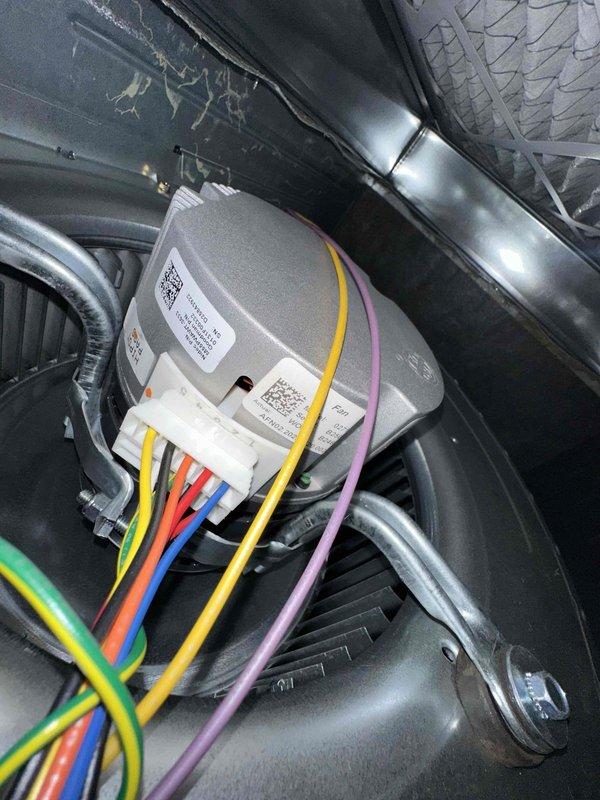Completed comprehensive first-year preventive maintenance on residential cooling system. Inspected and tested dual-run capacitor (45+5 MFD, 370VAC) for proper operation and verified all electrical connections were secure. Examined blower motor wiring harness, condenser unit components, and ductwork; found all systems operating within normal parameters with no immediate repairs required.