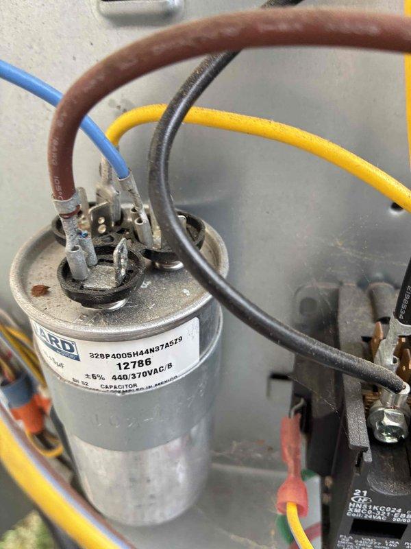Completed comprehensive HVAC tune-up service on residential cooling system. Performed electrical diagnostics using clamp meter, confirming proper amperage draw of 5.78A and voltage reading of 88V at the compressor circuit. Inspected dual-run capacitor (FASCO 440/370VAC) and associated wiring connections, verifying all terminals secure and components functioning within normal parameters.