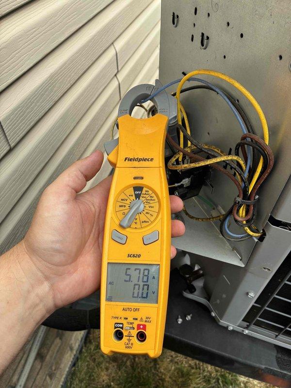 Completed comprehensive HVAC tune-up service on residential cooling system. Performed electrical diagnostics using clamp meter, confirming proper amperage draw of 5.78A and voltage reading of 88V at the compressor circuit. Inspected dual-run capacitor (FASCO 440/370VAC) and associated wiring connections, verifying all terminals secure and components functioning within normal parameters.