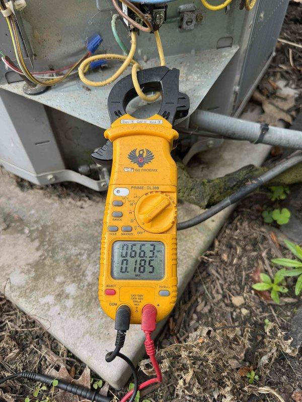 Performed comprehensive cooling system tune-up on residential HVAC unit. Conducted electrical diagnostics using clamp meter to verify amperage draw and system performance, inspected outdoor condenser unit including refrigerant lines and connections, and evaluated control board operation inside air handler. All components found operating within normal parameters and system ready for continued service.