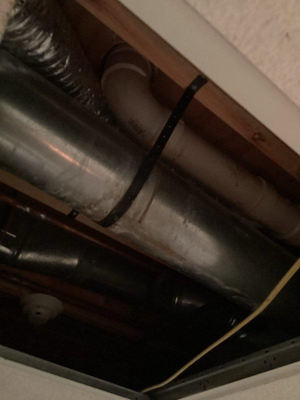 Responded to customer report of dampness in basement ceiling due to leaking pipes. Upon inspection, identified water infiltration in the ceiling area originating from plumbing infrastructure above. Accessed crawl space to examine exposed piping and ductwork secured to structural beams. Located source of leak in water supply lines and performed necessary repairs to stop active water seepage. Verified all plumbing fixtures, including toilet installation in affected area, for proper function and additional leak points. Completed repairs and confirmed cessation of water leakage to prevent further moisture damage to ceiling and surrounding areas.