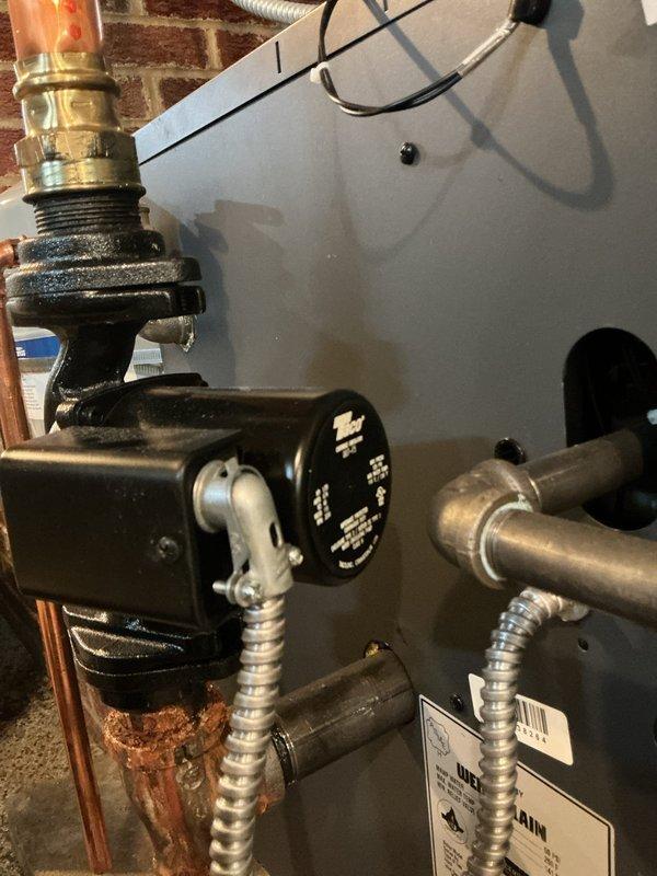 Installed new T-bell fittings (11/4-11/4 and 3/4) with threaded nipples and drain valve on water heater plumbing system. Replaced aging copper pipe connections and valve assembly showing corrosion and mineral deposits. All components tested and verified operational upon completion.