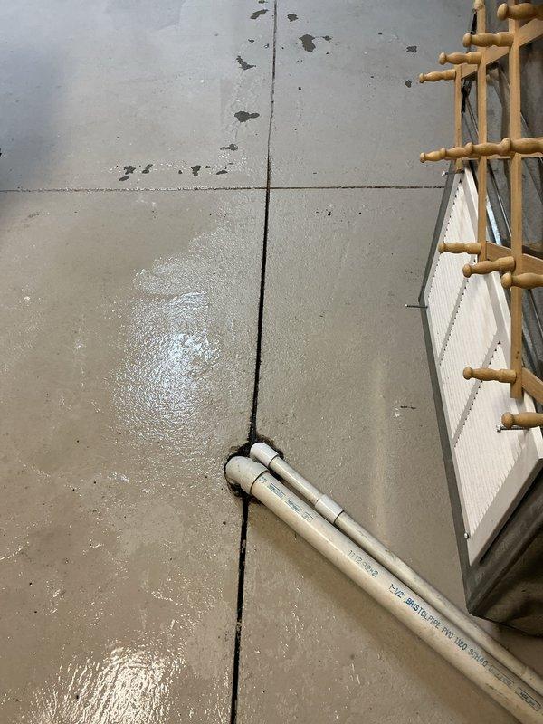 Responded to callback for standing water in A/C condensate drain line. Upon arrival, found approximately one inch of water remaining in drain pan from previous day's service visit. Cleared blockage from condensate line, verified proper drainage flow, and confirmed drain pan was emptying completely. System tested and operating within normal parameters with no further drainage issues observed.