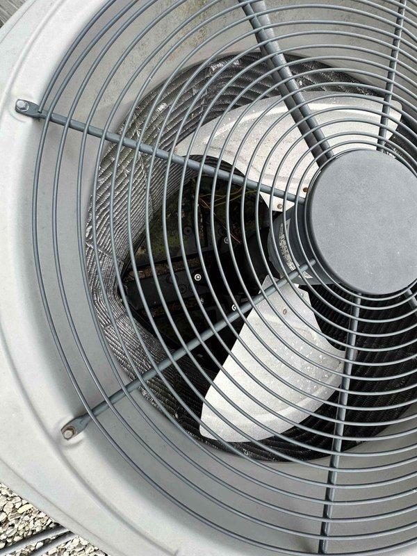 Performed thorough coil wash on outdoor condenser unit to restore optimal heat transfer efficiency. Cleaned condenser coils, fan assembly, and protective guard to remove accumulated debris and buildup. Unit operational with improved airflow following service completion.