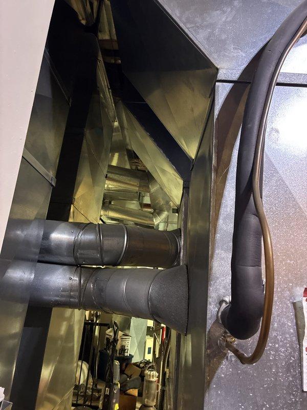 Conducted comprehensive assessment of existing 20-year-old HVAC system for full replacement estimate. Inspected furnace unit with exposed blower motor assembly and internal components, documented air handler configuration with ductwork connections and refrigerant lines, and evaluated overall system condition to provide accurate replacement recommendations for complete heating and cooling system upgrade.
