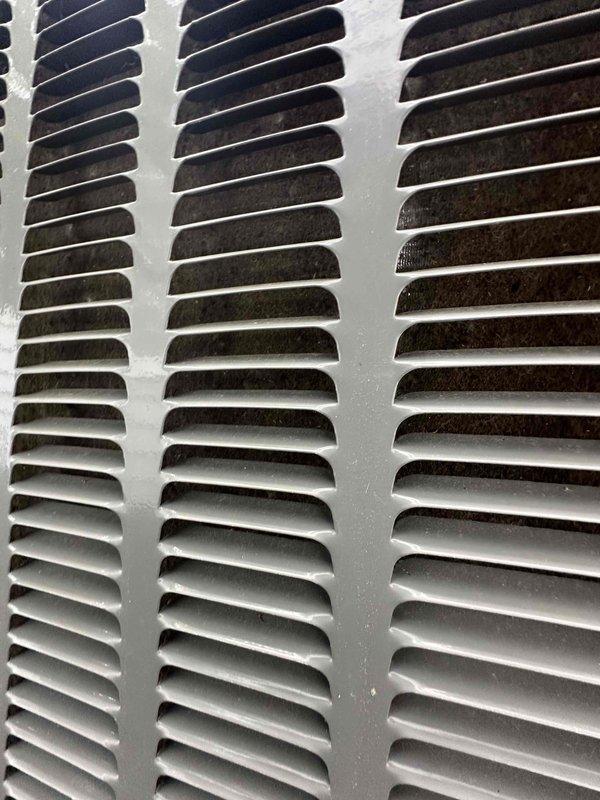 Completed comprehensive HVAC tune-up service including system inspection and performance testing. Cleaned dirty supply vent grille showing significant dust and particulate accumulation throughout louvers and openings. Performed electrical diagnostics using clamp meter to verify proper amperage draw and system operation, ensuring all components functioning within manufacturer specifications.