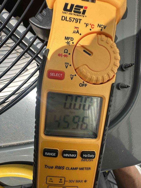 Completed comprehensive HVAC tune-up service including system inspection and performance testing. Cleaned dirty supply vent grille showing significant dust and particulate accumulation throughout louvers and openings. Performed electrical diagnostics using clamp meter to verify proper amperage draw and system operation, ensuring all components functioning within manufacturer specifications.