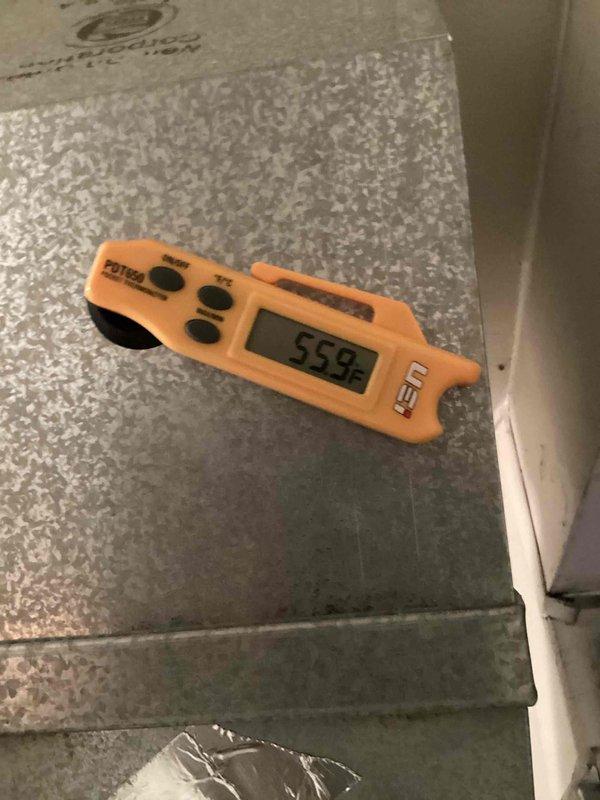 Completed routine HVAC cooling system maintenance including temperature diagnostics and system performance verification. Supply air temperature measured at 55°F at the ductwork, confirming proper cooling operation. Inspected exterior disconnect and electrical service components to ensure safe system operation.