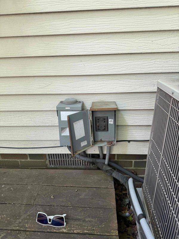Responded to no cooling complaint on aging residential air conditioning system. Upon arrival, performed diagnostic evaluation of outdoor condensing unit and associated electrical components. Utilized digital multimeter to measure voltage and verify proper electrical supply to equipment, obtaining readings to assess system functionality. Inspected exterior disconnect boxes, conduit connections, and power supply infrastructure mounted on building exterior. Conducted thorough assessment of unit age and overall condition to determine serviceability and provide customer with repair versus replacement recommendations for their consideration.