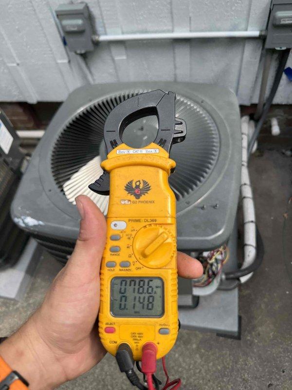 Responded to no cooling complaint on dual AC system. Performed diagnostic testing on both outdoor condenser units using digital clamp meter to measure electrical values and capacitor function. Cleaned condenser coils and verified component operation on both units to restore proper cooling performance.
