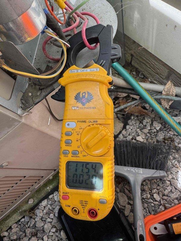 Completed comprehensive cooling system tune-up and performance evaluation. Performed electrical diagnostics using clamp meter to verify proper amperage draw and voltage supply at the outdoor condenser unit, while utilizing vacuum gauge to assess system integrity and refrigerant circuit condition. All measurements fell within manufacturer specifications, confirming optimal system operation and efficiency for continued reliable cooling performance.