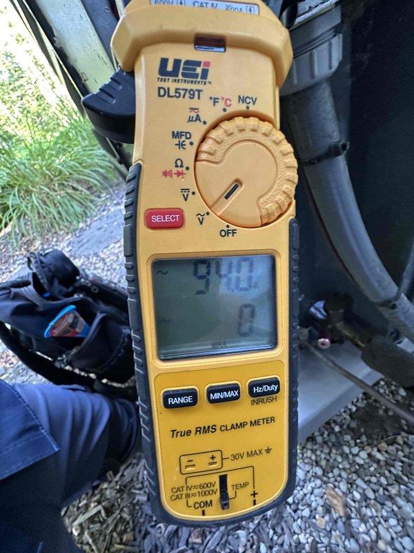 Performed routine HVAC cooling system maintenance on residential unit. Conducted electrical diagnostics using clamp meter to verify proper amperage and voltage levels at equipment. Inspected condenser coil and documented heavy accumulation of dirt and debris on fins, which restricts airflow and reduces system efficiency. Evaluated air filter condition for potential replacement to maintain optimal system performance and indoor air quality.