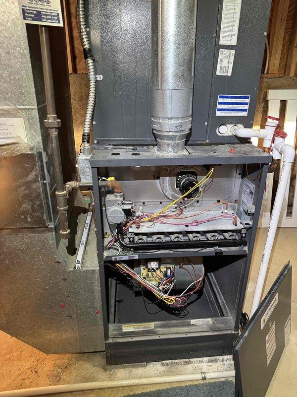 Completed comprehensive cooling season tune-up on residential HVAC system. Performed full system inspection with furnace access panel removed to examine internal components, control boards, and electrical connections. Replaced air filter and verified proper airflow through system.