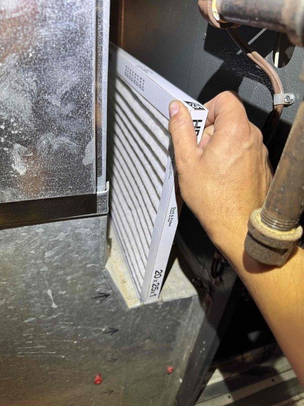 Completed comprehensive cooling season tune-up on residential HVAC system. Performed full system inspection with furnace access panel removed to examine internal components, control boards, and electrical connections. Replaced air filter and verified proper airflow through system.