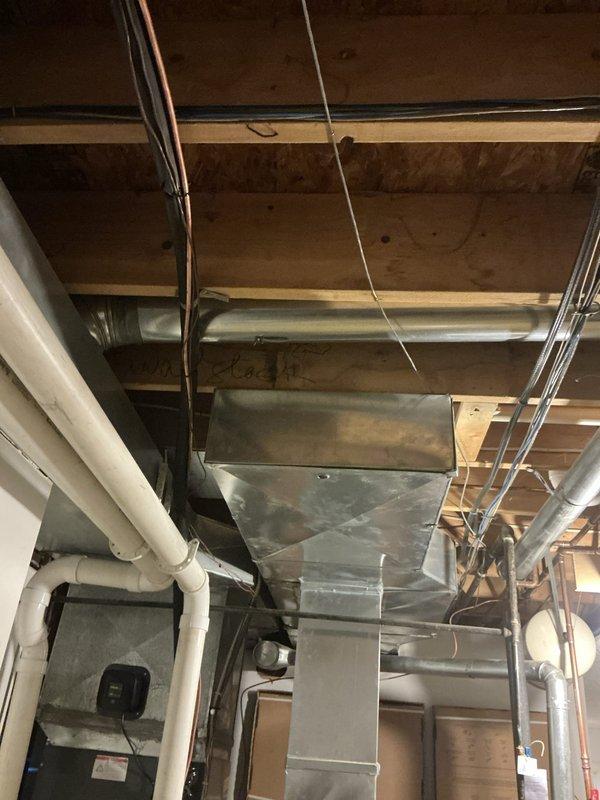 Conducted on-site evaluation for potential supplemental cooling system installation for upstairs living area. Assessed existing HVAC infrastructure including basement ductwork routing, available space for equipment placement, and current system capacity. Documented existing mechanical systems and upstairs room configuration to provide recommendations for optimal comfort solution.
