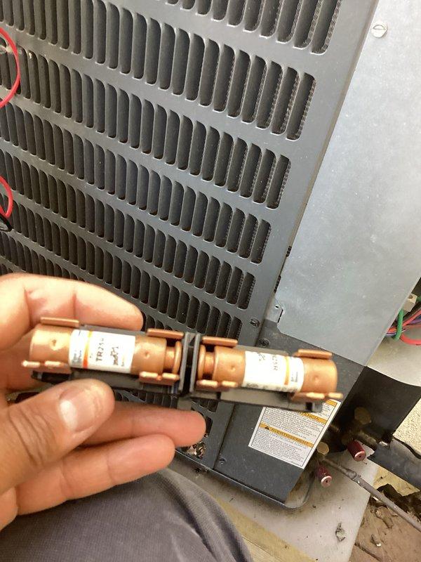 # HVAC Cooling Maintenance Summary

Performed routine cooling system maintenance including inspection of electrical components and safety devices. Examined and tested dual fuses in the disconnect assembly, verifying proper amperage ratings and electrical continuity. Conducted comprehensive electrical diagnostics using digital multimeter to measure voltage and current at capacitor terminals and control module connections. Inspected run capacitor and start components for proper operation, checking all wire connections including control wiring throughout the system. All safety devices, electrical connections, and components found to be functioning within manufacturer specifications. System operational and ready for continued service.