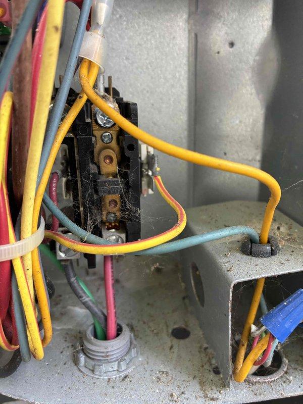Completed scheduled preventive maintenance on residential cooling system. Performed electrical diagnostics using clamp meter to verify proper amperage draw and voltage readings at outdoor condensing unit, confirming system operating within manufacturer specifications at 70.11 volts with zero amp draw at time of measurement. Inspected electrical control panel and wiring connections, noting all conductors properly secured and terminals tight with no signs of overheating or electrical faults.