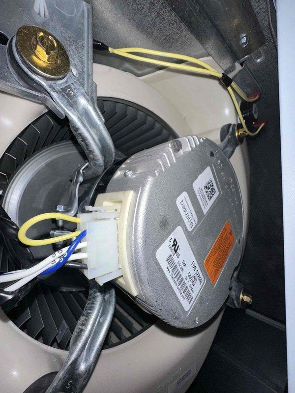 Completed first-year cooling system maintenance including inspection of blower motor assembly and installation of customer-provided air filter. Verified thermostat operation with ecobee unit displaying proper cooling mode functionality at 66 degrees, confirmed blower motor electrical connections secure, and assessed overall system performance with no issues identified.