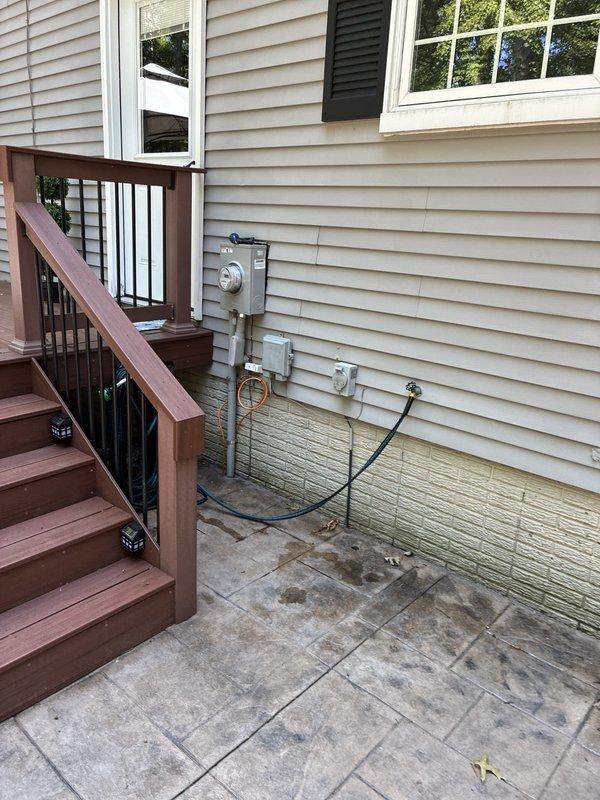 Completed comprehensive evaluation of existing HVAC system and provided full system replacement options to customer. Documented current equipment configuration including outdoor condensing unit location near electrical service panel and utility meters on exterior wall, as well as interior thermostat (PRO model programmable unit currently reading 79°F). Presented multiple replacement system proposals with varying efficiency levels and features for customer consideration.