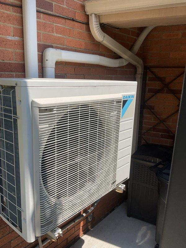 Completed comprehensive cooling season tune-up on Daikin outdoor condensing unit, including inspection of electrical disconnect, refrigerant line connections, and drainage system. All components found operating within manufacturer specifications, with unit ready for optimal summer performance.