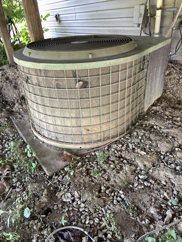 Responded to no cooling complaint and performed system evaluation for replacement estimate. Assessed existing outdoor condenser unit showing significant age and wear, along with interior system access point. Documented equipment condition, photographed current installation configuration, and provided customer with multiple replacement system options for 2-3PM time slot as requested while customer obtains additional estimates for comparison.
