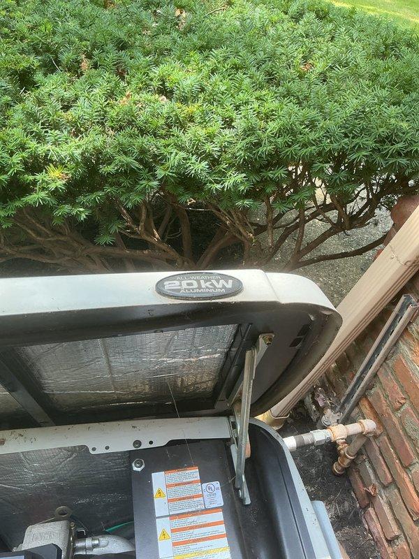 Responded to service call for generator with reported leak. Upon arrival, performed visual inspection of unit exterior and internal components. Inspected gas valve assembly, control mechanisms, piping connections, and surrounding equipment for signs of fuel or fluid leakage. Examined refrigerant lines, copper piping, and all connection points. Documented equipment condition through photographs for service records. Unit found to be outdoor installation positioned against building structure with adequate clearance and ventilation.