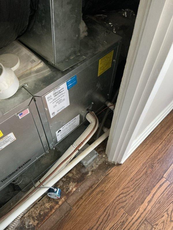 Responded to no cooling complaint on residential split system HVAC unit. Upon arrival, performed diagnostic evaluation of indoor air handler located in utility closet and outdoor condensing unit positioned at exterior of home. Inspected system components including refrigerant lines, electrical connections, and drainage piping. Verified unit specifications and manufacturer information, documented equipment condition and installation configuration for service records.
