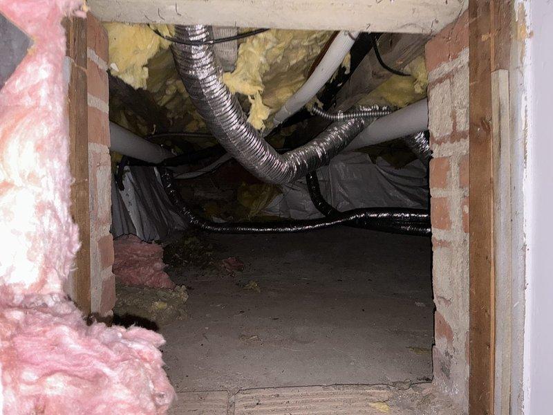 Conducted comprehensive HVAC system evaluation for replacement estimate on existing Unico system with reported refrigerant leak and high repair costs from previous assessment. Inspected dual outdoor condenser units, crawlspace ductwork including flexible metal ducts and PVC condensate lines, and evaluated overall system condition to provide replacement options for the customer.