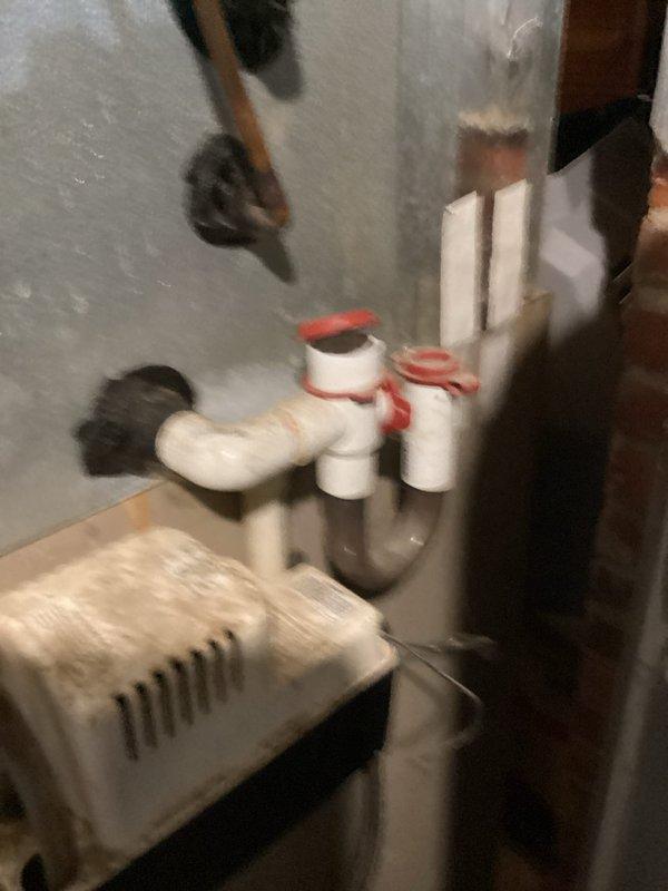 Completed scheduled preventive maintenance on residential cooling system. Inspected and photographed outdoor disconnect panel with electrical components including contactors, capacitor, and associated wiring connections. Verified indoor air handler unit and plumbing connections in utility area were operating within normal parameters.