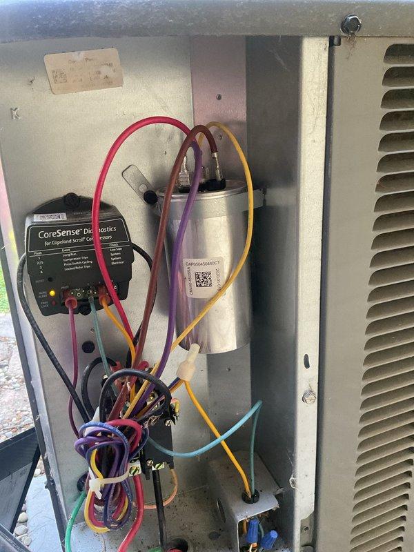 Completed routine cooling maintenance on residential HVAC system located in attic space. Accessed air handler unit via ladder, replaced air filter with correct size per customer request, and performed comprehensive system inspection. Installed CoreSense diagnostic equipment on Copeland scroll compressor to verify operational performance, checked all electrical connections, inspected capacitor condition, and confirmed proper system operation with all parameters within normal range.