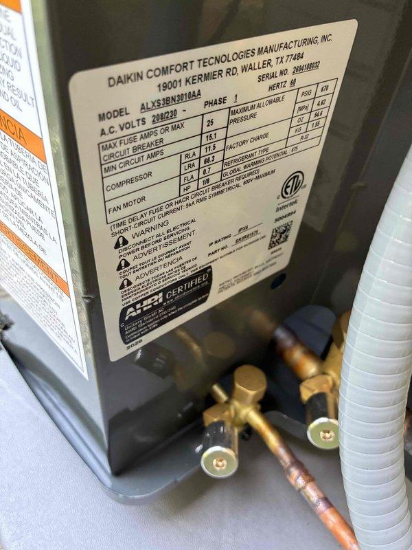 Completed full HVAC system installation including Daikin model ALXS3BN1U144A outdoor condensing unit rated for 208/230V operation. Installed refrigerant line set with proper brazing and insulation, connected service ports, and established all electrical connections per manufacturer specifications. Performed system startup, charged unit to proper refrigerant levels, and verified operational parameters using calibrated digital manifold gauges, confirming system pressures of 138.3 psig low side and 315.3 psig high side with appropriate temperature differentials across the coil. System tested and operating within normal specifications.
