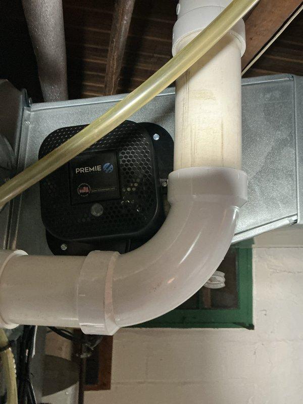 Completed comprehensive cooling system maintenance on residential HVAC unit. Inspected air handler, condensate drainage system with PremierOne condensate pump, ductwork connections, and all electrical components including control board and safety switches. System tested and operating within normal parameters; all warning labels and safety documentation verified in place.