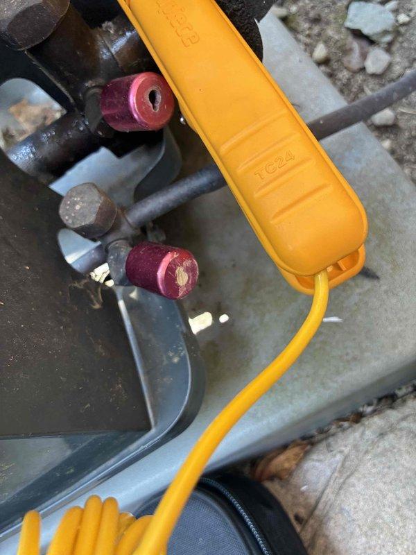 Completed cooling season tune-up on outdoor condensing unit. Connected manifold gauges to service ports and verified refrigerant pressures and system operation. Inspected condenser fan motor, grille assembly, and all accessible components for proper function and wear. Unit operating within normal parameters with no issues identified.