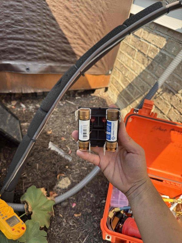 Performed routine cooling maintenance on residential outdoor condensing unit. Inspected and tested electrical components including fuse block assembly, verified proper amperage and connections, and confirmed system operation. Cleared debris from surrounding area and ensured adequate airflow around unit for optimal performance.