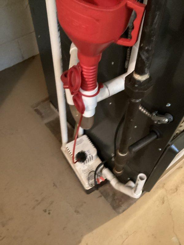 Completed comprehensive HVAC cooling system maintenance inspection. Verified condensate pump operation and drainage system functionality, confirming proper water removal from the air handling unit. Measured supply air temperature at 53.9°F, indicating optimal cooling performance and refrigerant charge levels within manufacturer specifications.
