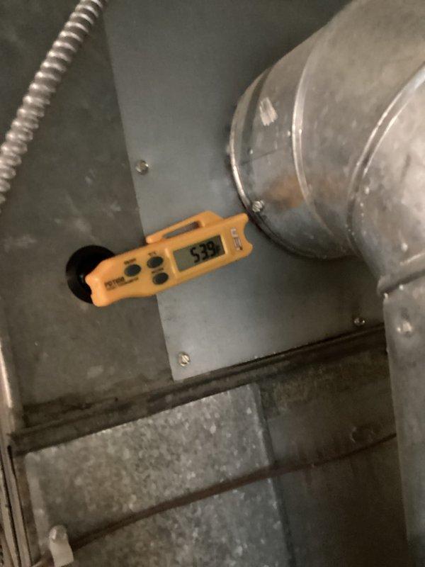Completed comprehensive HVAC cooling system maintenance inspection. Verified condensate pump operation and drainage system functionality, confirming proper water removal from the air handling unit. Measured supply air temperature at 53.9°F, indicating optimal cooling performance and refrigerant charge levels within manufacturer specifications.