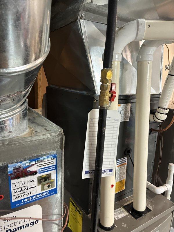 # A/C Installation Complete

Successfully completed installation of new air conditioning system in residential basement mechanical room. Installed new AC unit with proper refrigerant line connections, condensate drainage via PVC piping system, and integrated ductwork with existing HVAC infrastructure. Performed system startup procedures and verified proper operation with digital multimeter readings showing 41.3°F supply air temperature. All electrical connections secured, refrigerant lines properly insulated, and system tested for optimal performance. Unit operating within manufacturer specifications with proper airflow and temperature differential confirmed.
