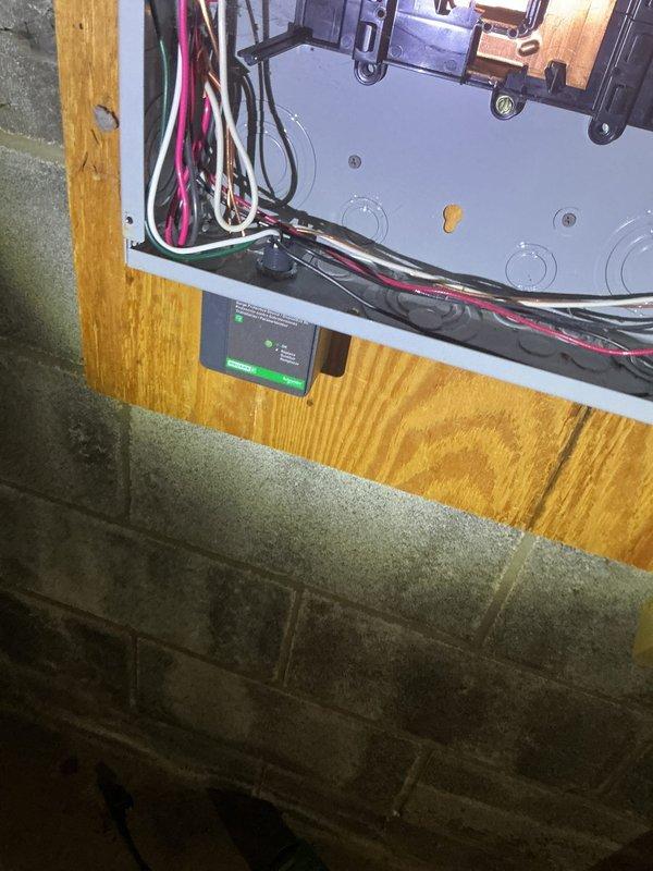 Completed comprehensive electrical service repair involving HVAC system integration and main electrical panel work. Addressed electrical connections at HVAC component mounted on wooden substrate, securing multiple circuit wires including line voltage conductors and ground connections to system control panel. Serviced main electrical distribution panel containing dual main breakers and approximately 30-40 branch circuit breakers, ensuring proper wire terminations and circuit organization throughout the two-column breaker arrangement. Verified all electrical connections at panel including incoming service conductors and outgoing branch circuits in various wire gauges, confirmed proper grounding and bonding connections, and ensured all safety devices were functioning correctly.