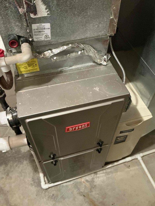 Provided estimates for replacement of two residential HVAC systems, both original 2005 R22 units experiencing refrigerant leaks and insufficient cooling capacity. Documented existing Bryant furnace installation and system configuration with accessible equipment locations to facilitate future replacement work.