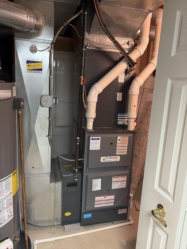 Completed comprehensive cooling season tune-up on residential HVAC system. Performed system diagnostics and electrical measurements using clamp meter, recording amperage readings of 433A and 4188W on the unit's electrical components. Inspected P.C. Hydronics furnace, air handler, condensate drain lines, copper refrigerant lines, and all associated ductwork and electrical connections, verifying proper operation and system performance for the cooling season.