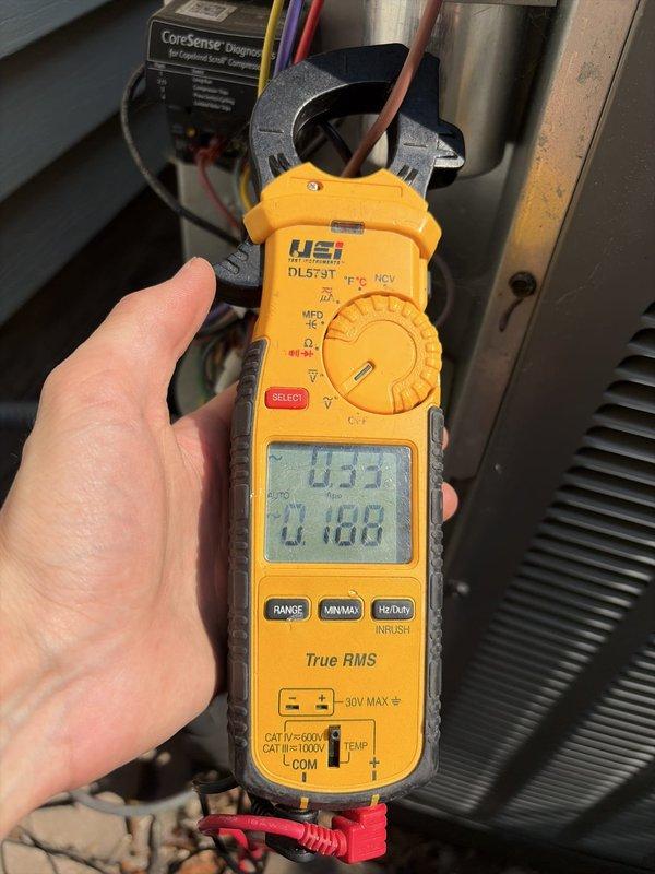 Completed comprehensive cooling season tune-up on residential HVAC system. Performed system diagnostics and electrical measurements using clamp meter, recording amperage readings of 433A and 4188W on the unit's electrical components. Inspected P.C. Hydronics furnace, air handler, condensate drain lines, copper refrigerant lines, and all associated ductwork and electrical connections, verifying proper operation and system performance for the cooling season.