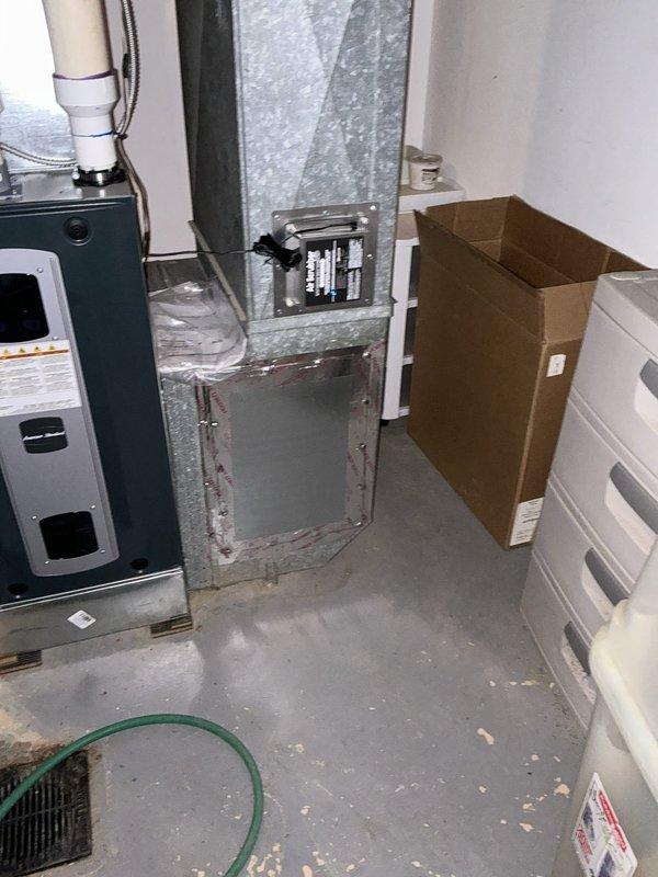Responded to no cooling complaint and performed comprehensive system evaluation. Upon inspection, determined existing HVAC equipment had failed beyond economical repair. Documented current installation including basement-mounted air handler, ductwork configuration, and exterior venting components. Provided customer with complete system replacement options and specifications for new equipment installation to restore cooling capacity.