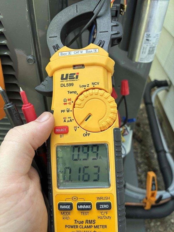 Completed system start-up and commissioning on newly installed Trane 5TTX6042A1000AA condensing unit. Verified electrical specifications including 208-230V single-phase power supply, confirmed proper amperage draw at 0.99A during operation, and validated all safety labels and manufacturer documentation are properly affixed to equipment. All systems tested and operating within normal parameters.